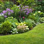Lush landscaped garden with flowerbed and colourful plants
