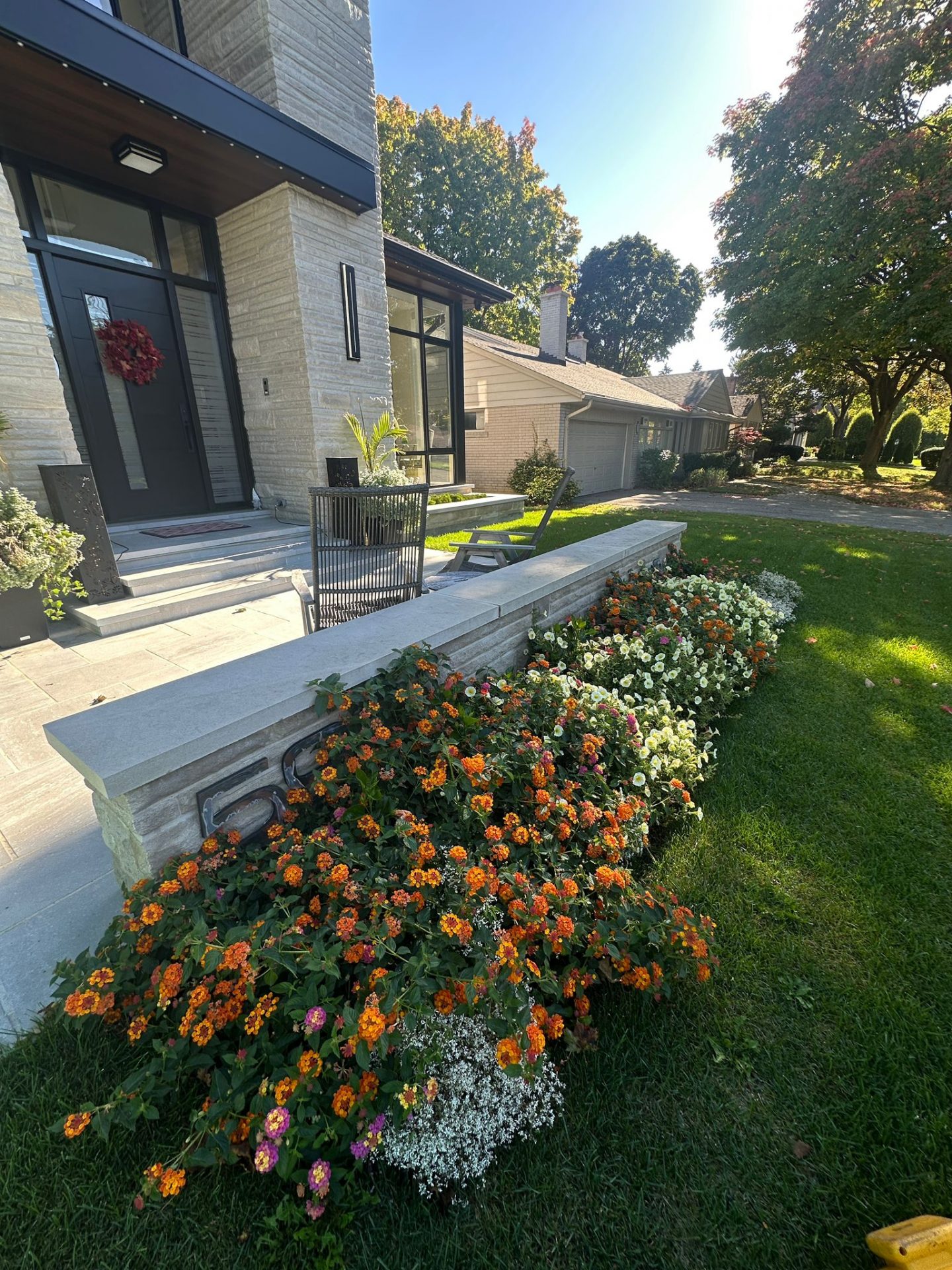 Modern house with vibrant garden in front yard