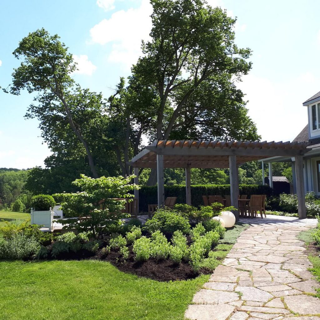 Garden with pergola and stone walkway