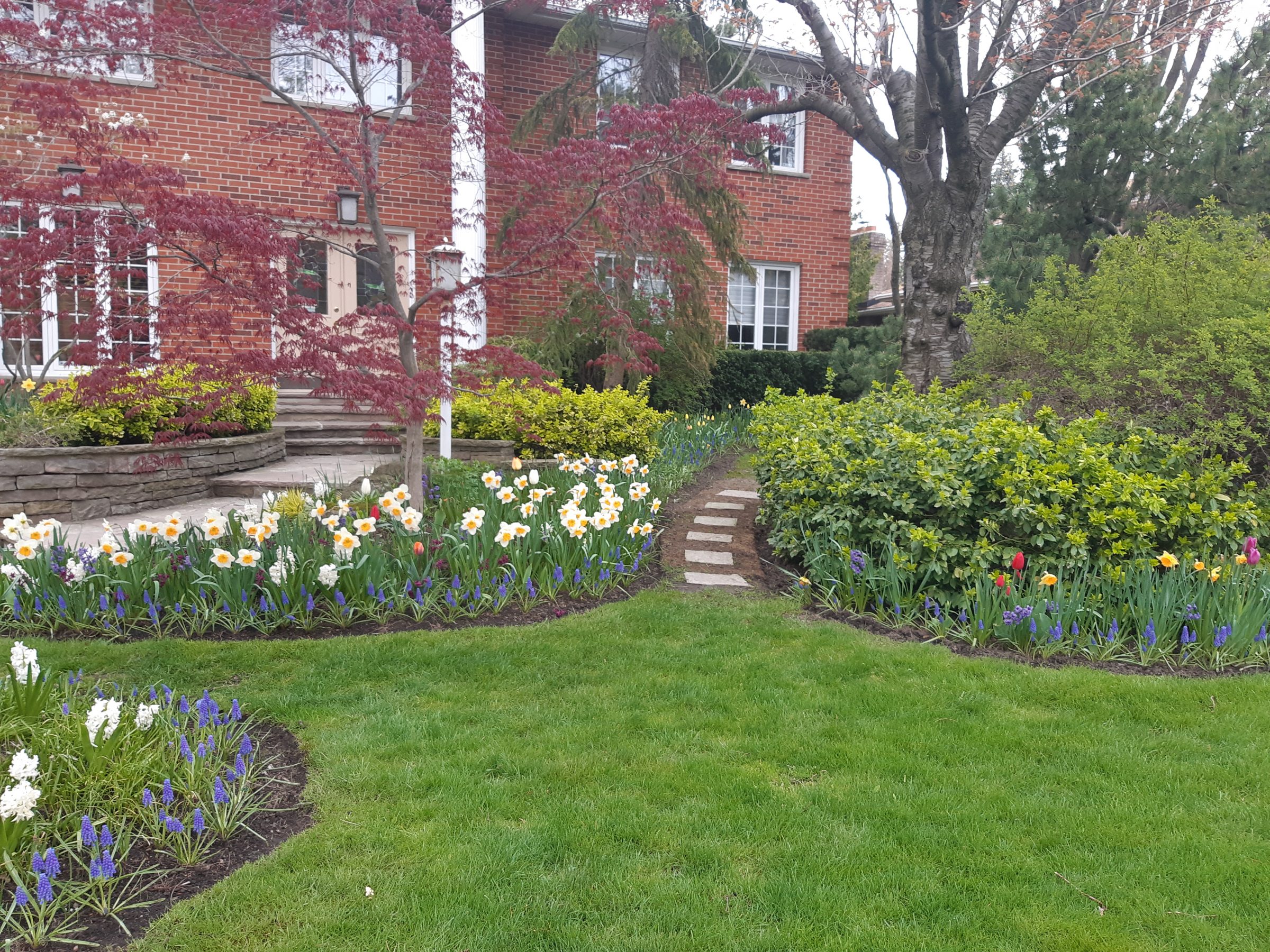 House with garden, flowers, and stone path