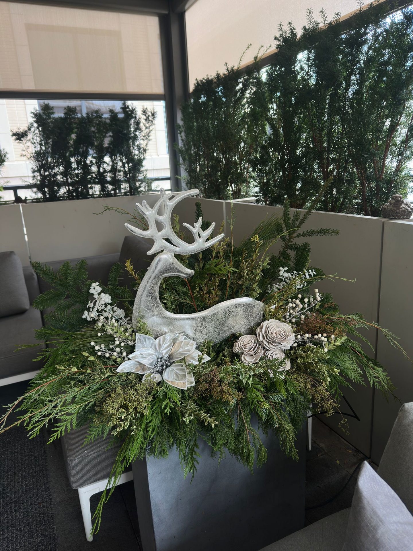 Decorative reindeer in floral arrangement