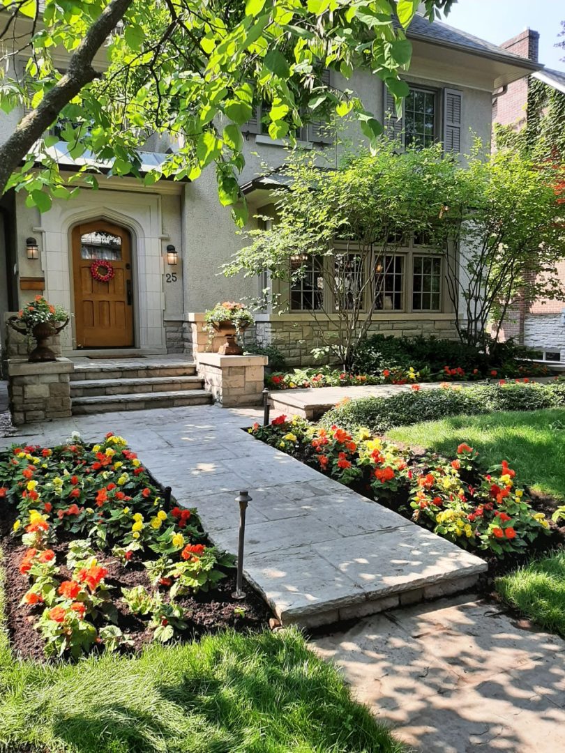Charming house with colorful flower garden entrance