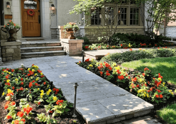 Elegant garden pathway with colorful flowers and shrubs.
